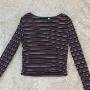 Long sleeve, tight fitting, slightly cropped.